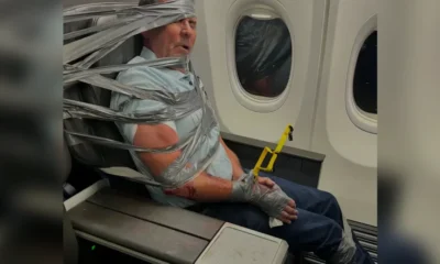 American Airlines uçağında ırkçı yolcu koli bandıyla bağlandı